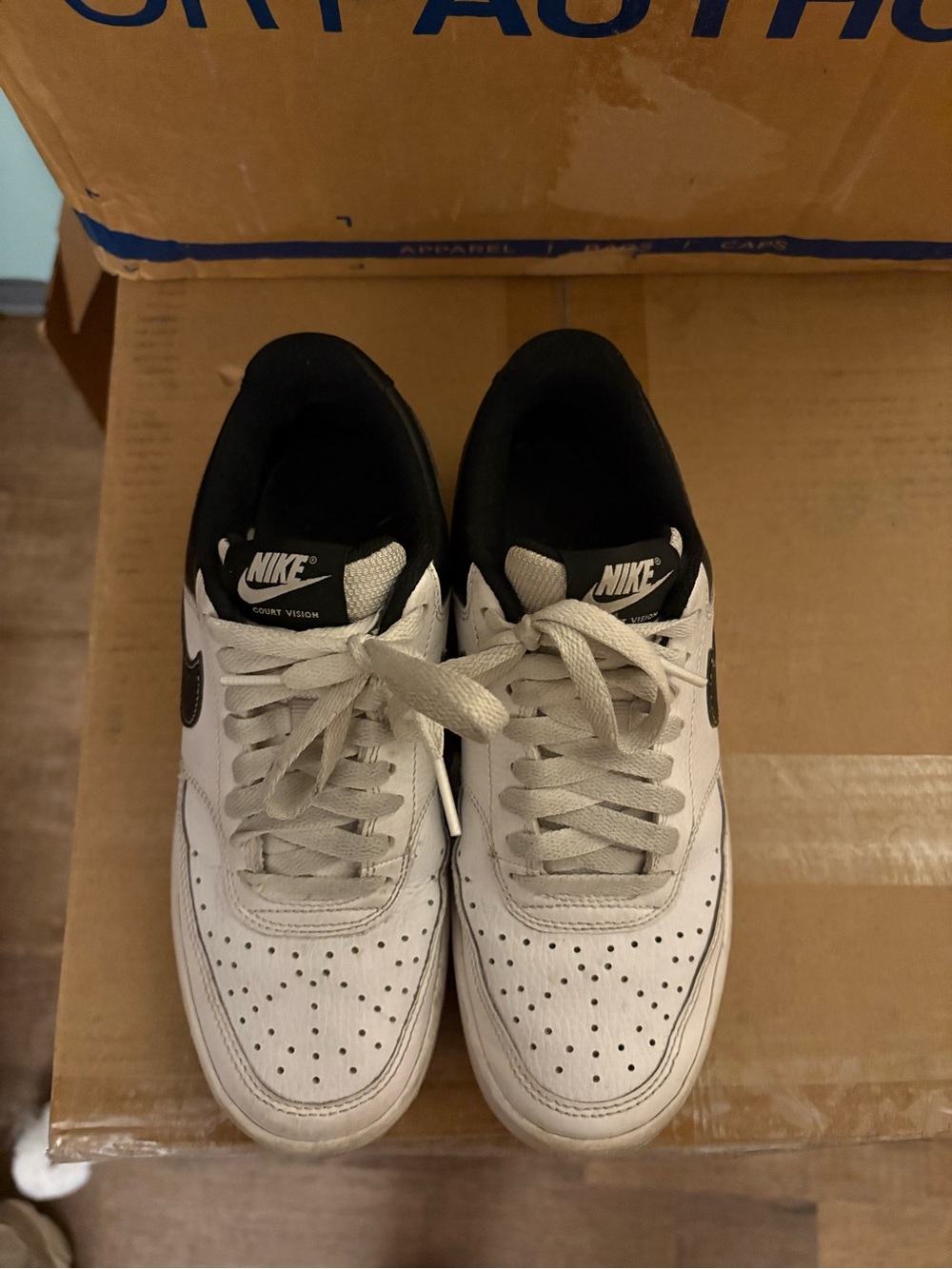 Nike White and Black Low-Top Sneakers with Black Swoosh